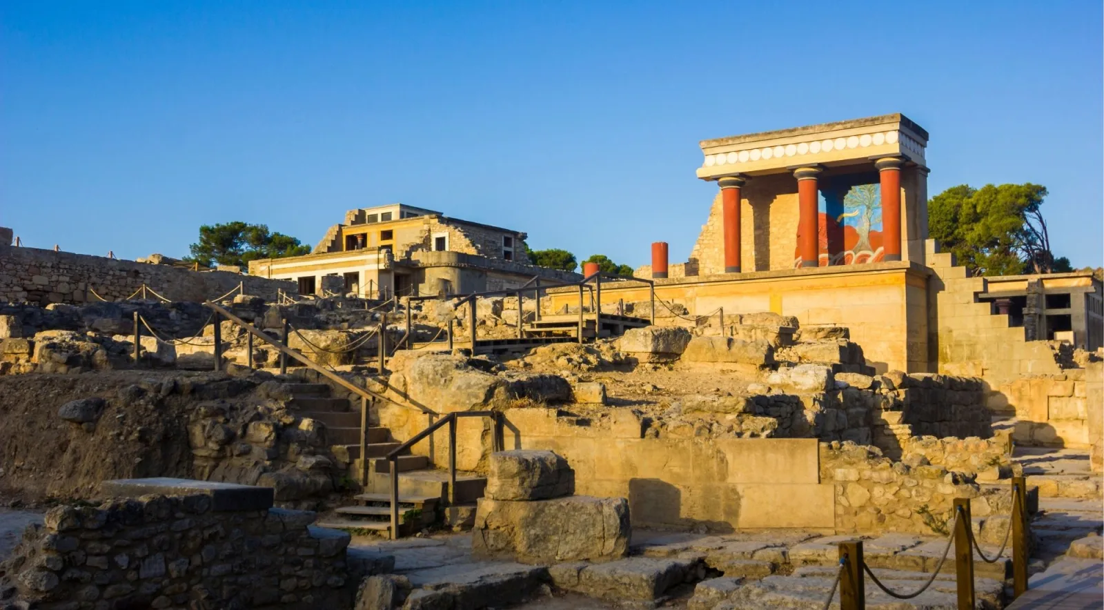 Wide view across the excavated ruins of Knossos towards the restored north portico