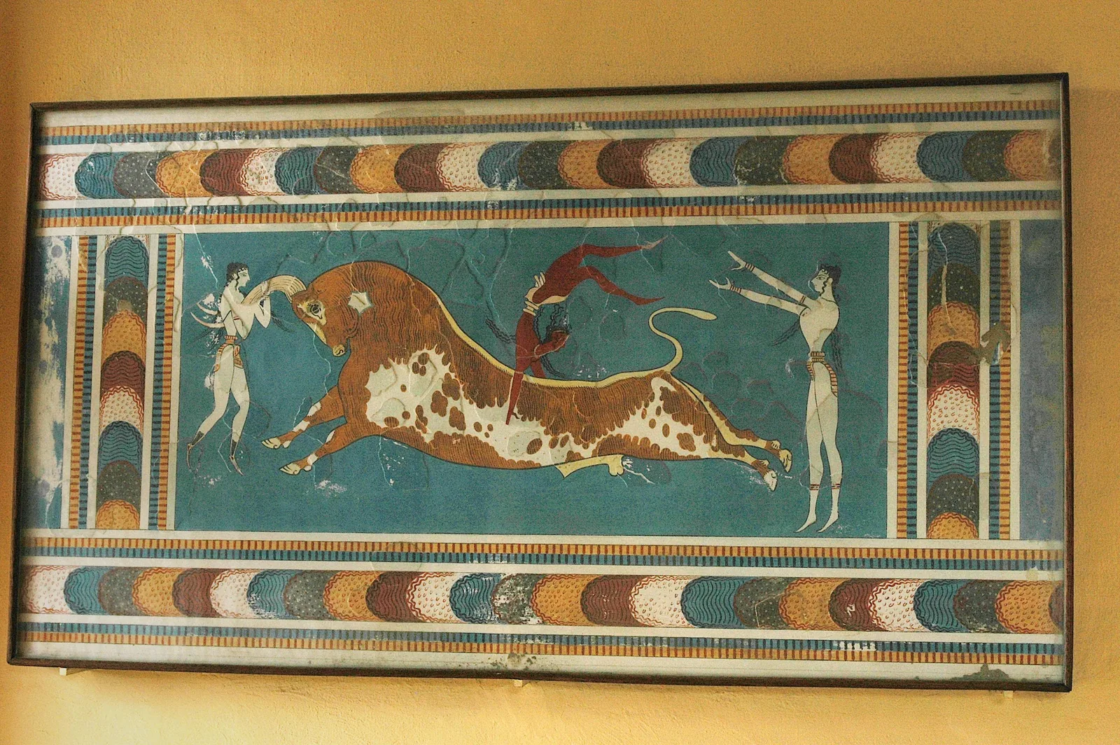 The Minoan bull-leaping fresco, acrobats vaulting a charging bull, in the Heraklion Archaeological Museum