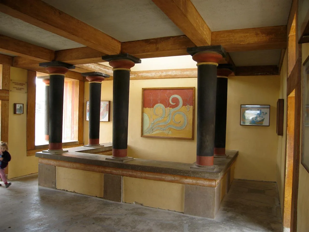 A restored columned hall at Knossos with black and red Minoan columns