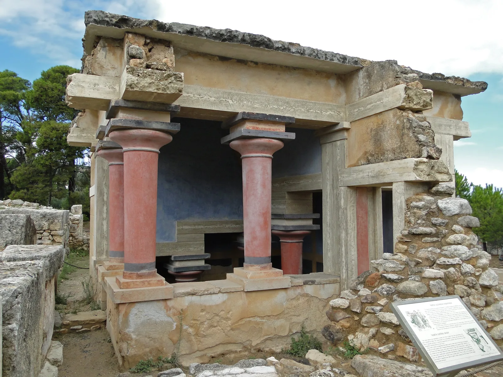 A restored columned chamber and stone walls in the residential quarter of Knossos
