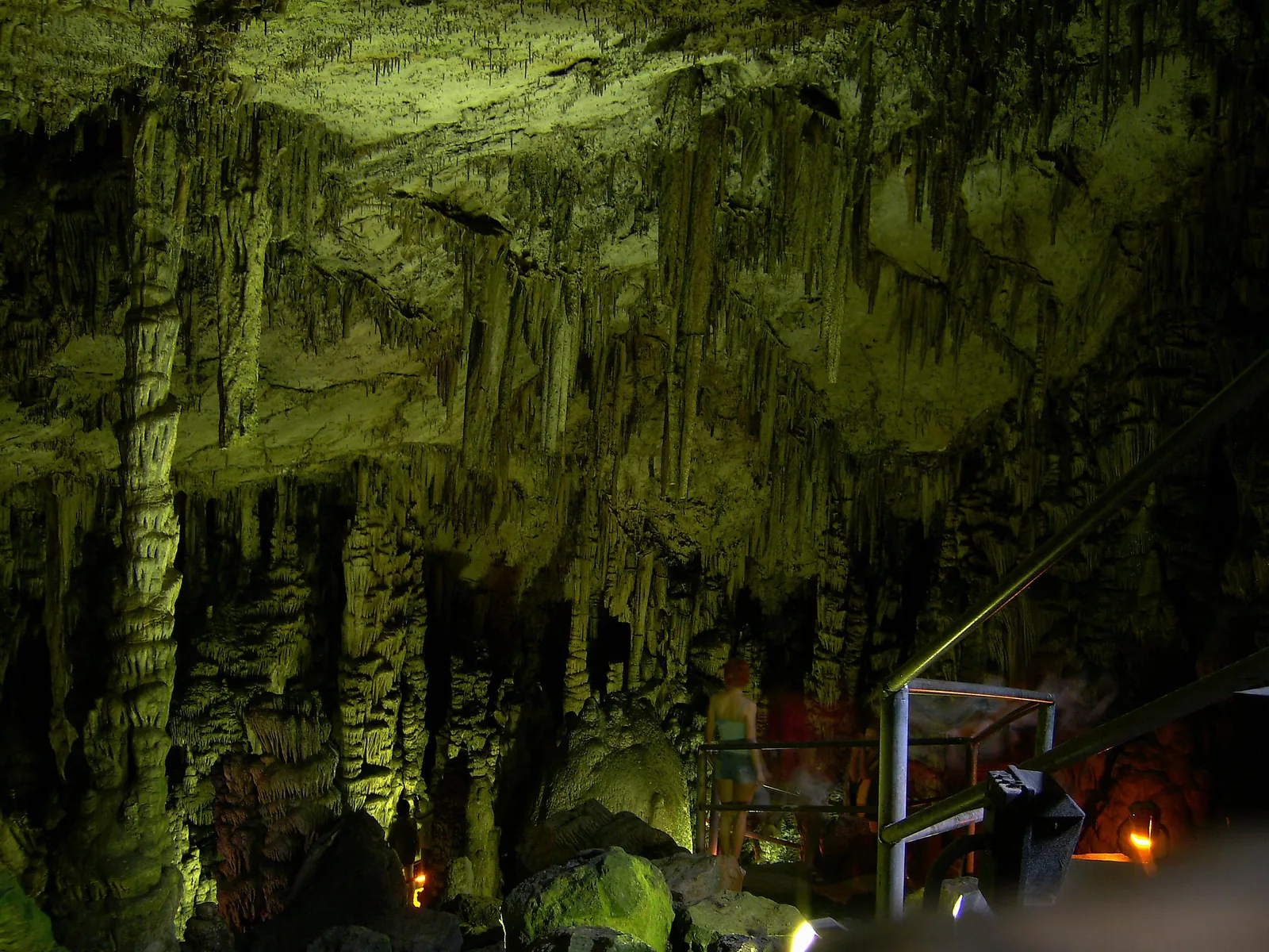 Illuminated stalactites and stalagmites inside the Psychro Cave of Zeus on Crete