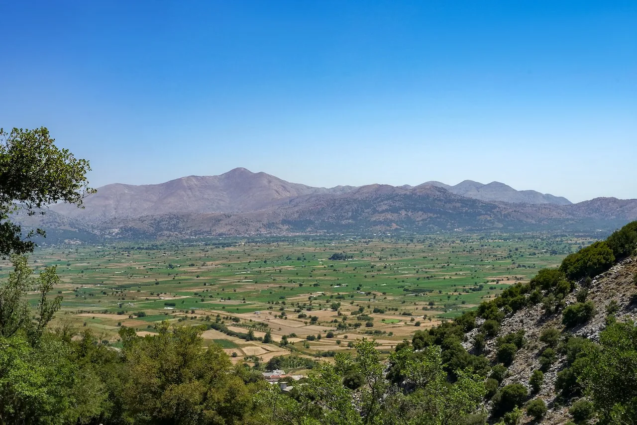 The green farmland of the Lasithi Plateau spread out below the surrounding mountains